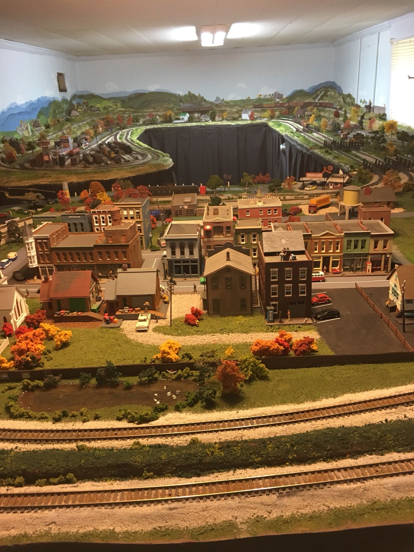Large ho scale model railroad includes engines rolling stock structures and scenery details!
