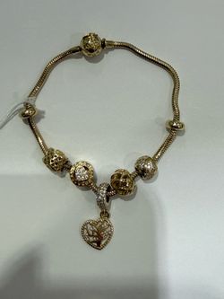 14k Bracelet w/ charms