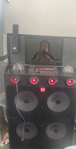Nutek portable DJ speaker system with an integrated screen and mixing board