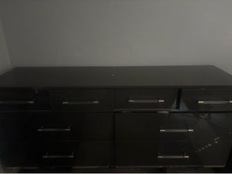 Black 6-drawer dresser. Approx. 60” W x 18” D x 30” H. Good condition with normal wear.