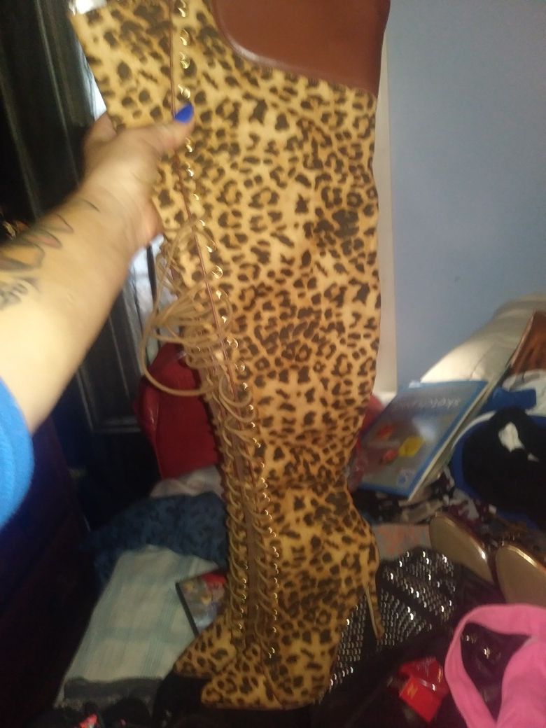 Thigh high cheetah print boots