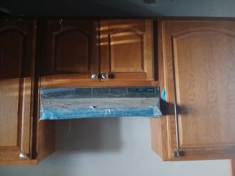 Kitchen cabinets with brand new range and back splash tiles