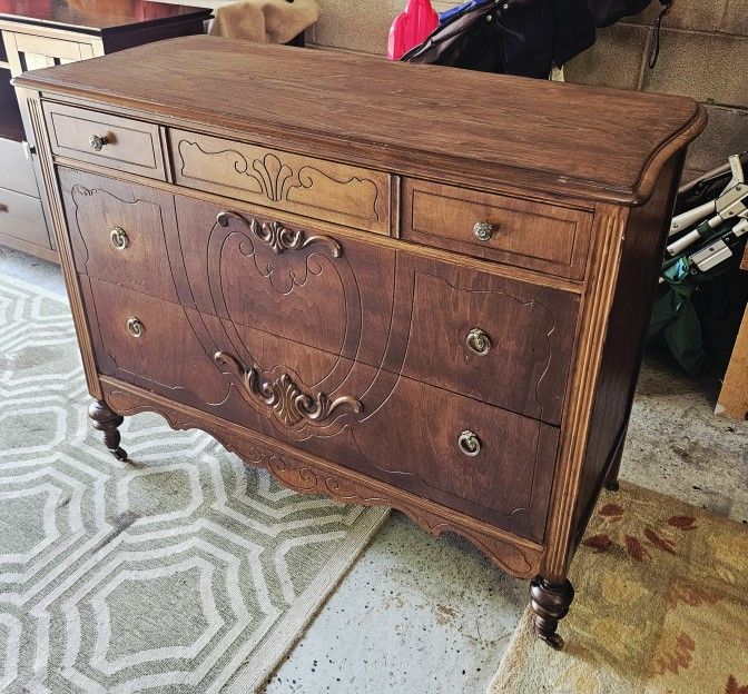 ANTIQUE CHEST ON CASTER WHEELS