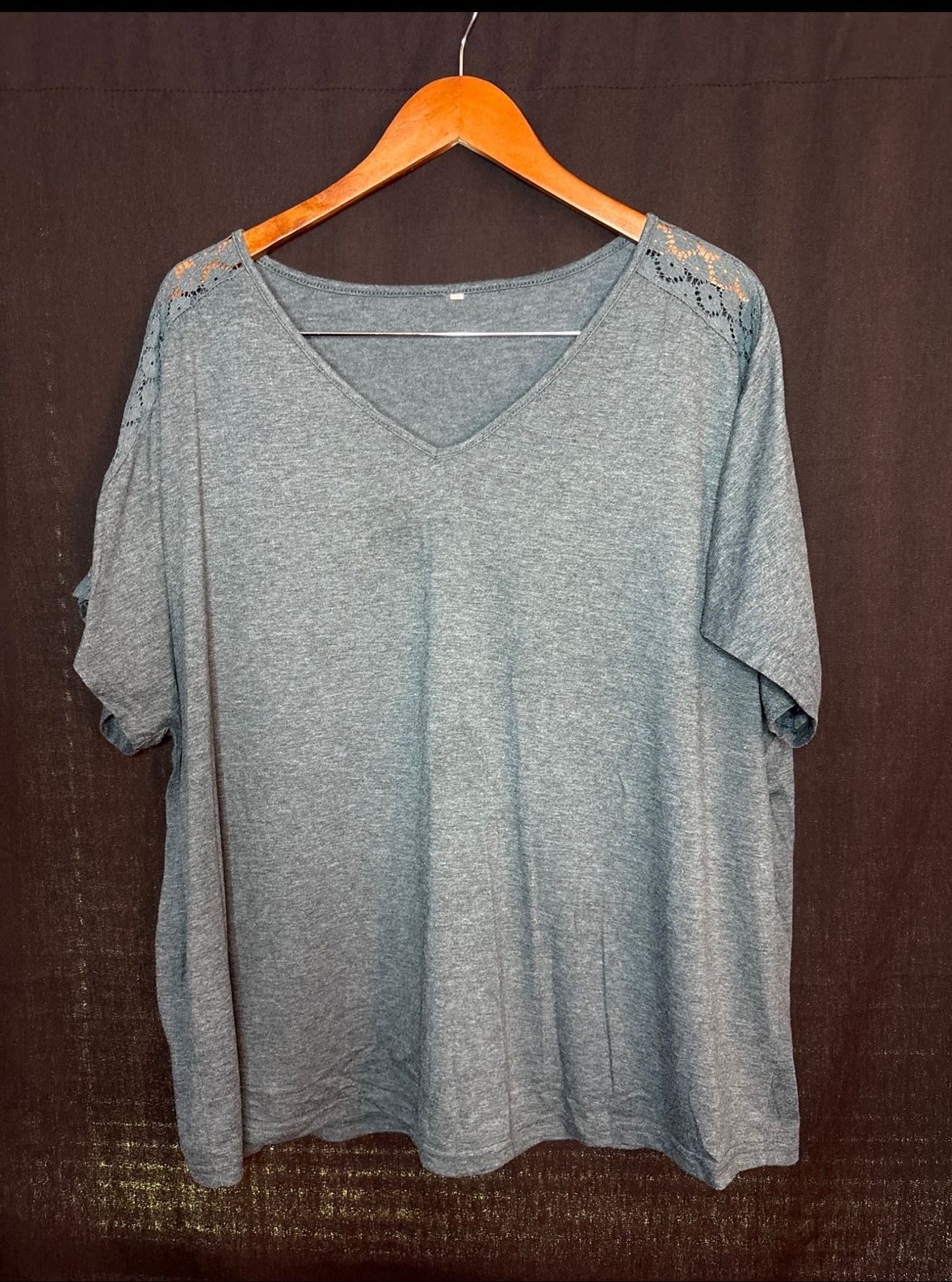 Green v-neck top with lace detail