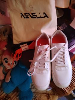 Novella White Low-Top Sneakers size 10 in men's brand new with dust bag! No box. Comes with two pairs of extra laces. All leather shoe also a one of o