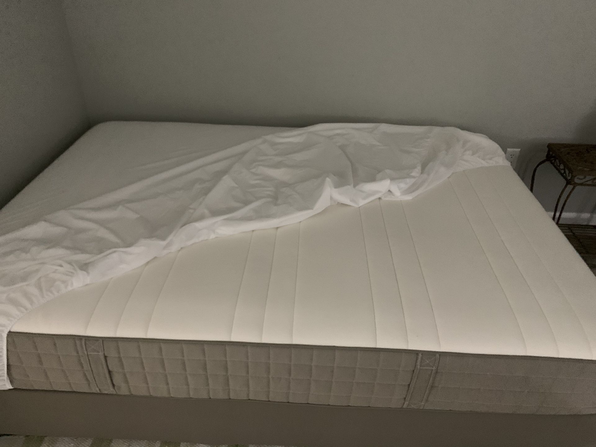 Full size mattress with box spring and legs.