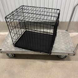 Dog cage with cleaning pan …  25 “ long , 18” wide , 21” high    $40
