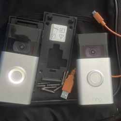 ring cameras (2) mounts, screws, and charger