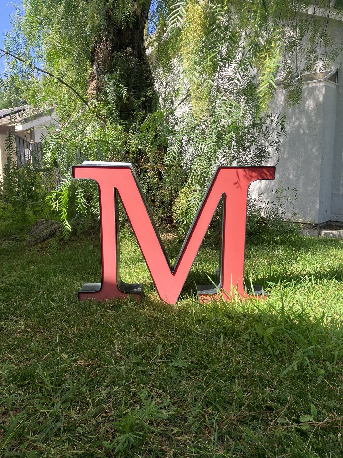 Sign marquee letter “M”