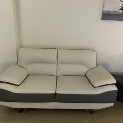 Grey and White Leather Loveseat Couch