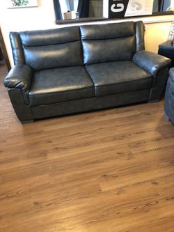 Grey leather sofa $549