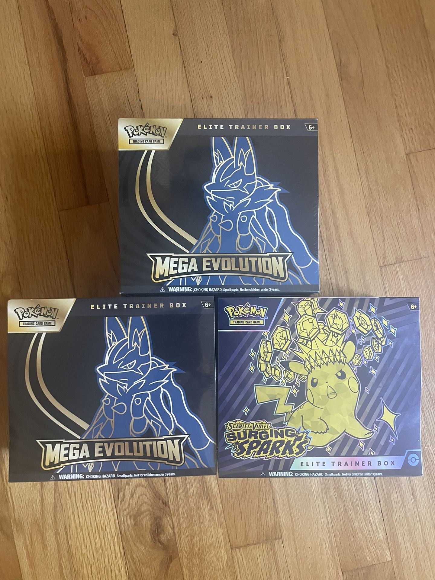 Pokemon Mega Evolutions and Surging Sparks ETB