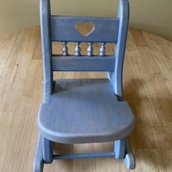 Vintage folding doll rocking chair hand painted in blue and silver. Showcase your favorite doll, beautiful nursery decor. Measures 12” high by 12” dee