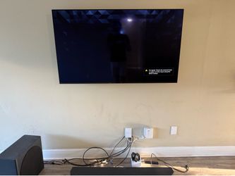 55 Inch Sony A80K with Soundbar and Apple TV