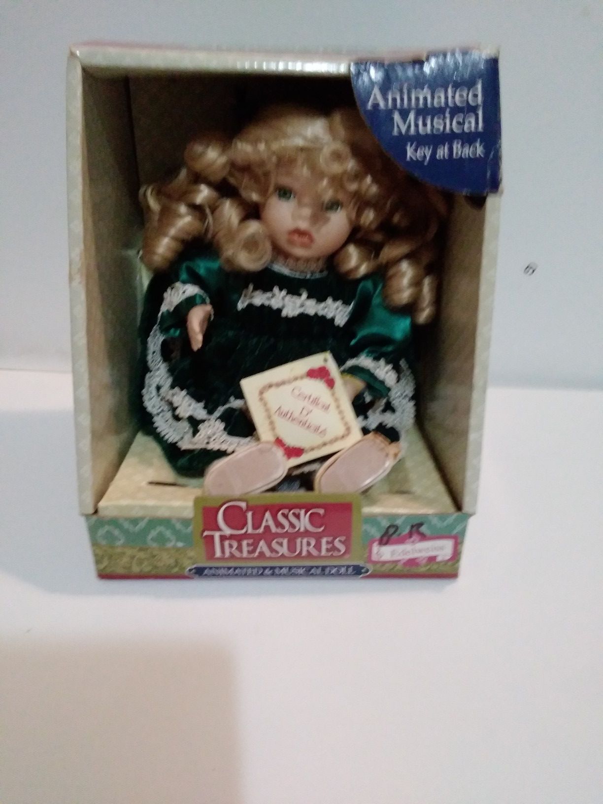 Classic treasures animated musical porcelain doll