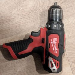 Milwaukee 2407-20 Driver Drill Plus Charger. No batteey.