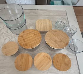 Gently used glass containers with some bamboo lids
