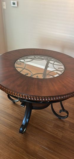 Solid wood and glass top dining table