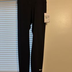 This product is a pair of Nike women's black XS training tight leggings, perfect for activewear. The leggings feature compression area for the leg and