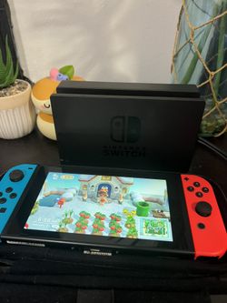 Nintendo Switch (with Charger And Case)