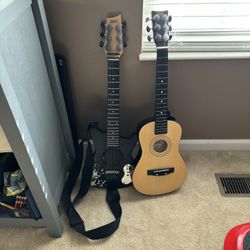 Guitars One Electric And One Has One String On It