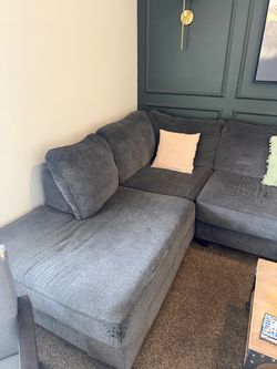 Large gray sectional sofa with an extended chaise lounge