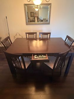 Wooden dining table with 6 chairs (Like new)
