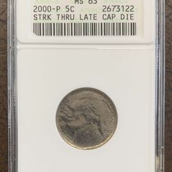MS63 Graded Struck Thru Late-Stage Capped Die Jefferson Nickel Mint Error