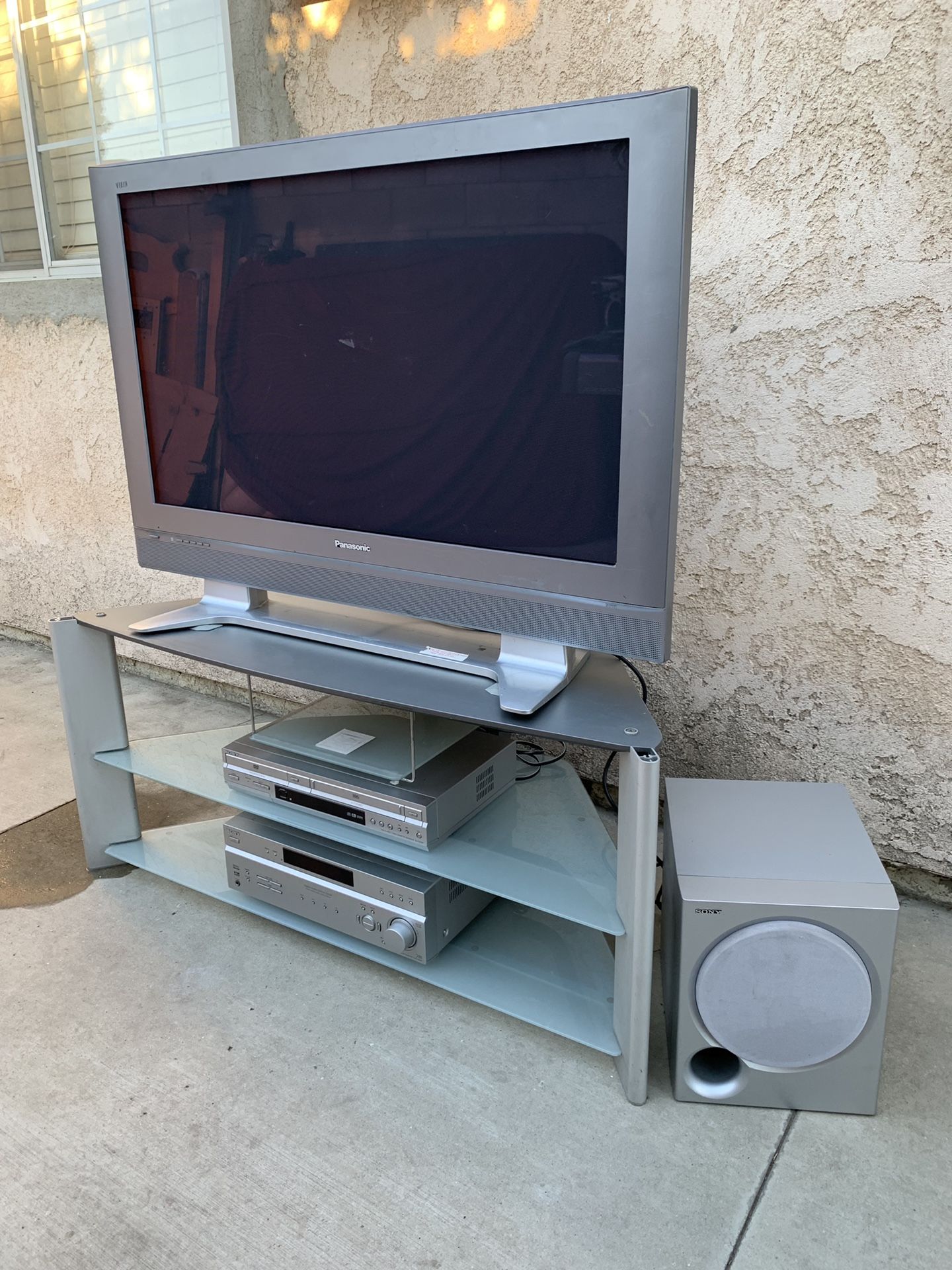 Panasonic 43” tv with tv stand and surround sound system Sony