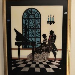 11" x 14" Silhouette Picture with areas of foil that shines with light.