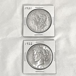 AU - (About Uncirculated) 1921 Morgan And 1922 peace silver dollars