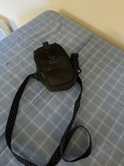 Compact black shoulder bag.