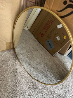 Gold round mirror