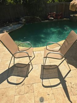 Set of 2 Outdoor Patio Sling Dining Chairs
  
​Selling a pair of outdoor patio chairs in good condition. Perfect for pool decks, backyards, patios, or