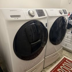 Samsung Front Load Washer and Electric Dryer Set with Pedestals 