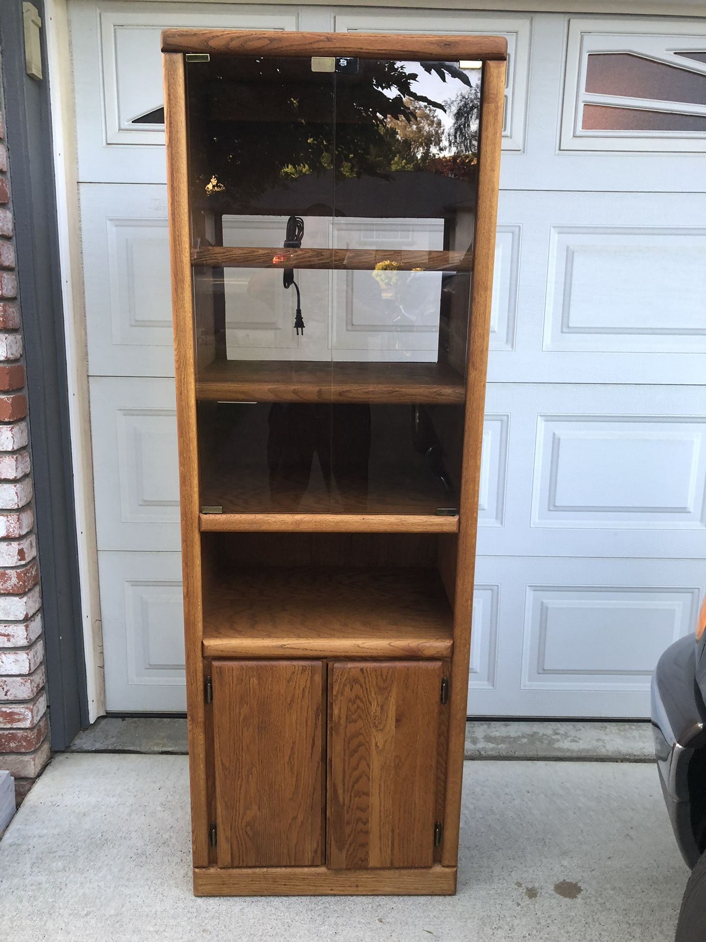 Tall Oak Stereo Cabinet With Glass Doors And Lighting