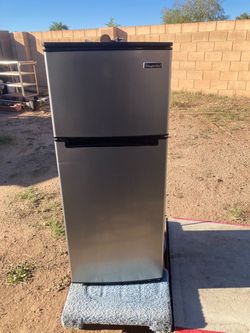 Magic Chef compact fridge . Silver and black with top freezer