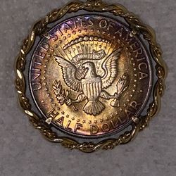 12k rope bezel holding a very nicely toned 40% silver Kennedy