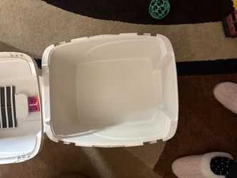 Cream colored cat litter box