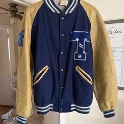 Howe Athletic Apparel, dark blue with tan leather arm, inside silky , size 42