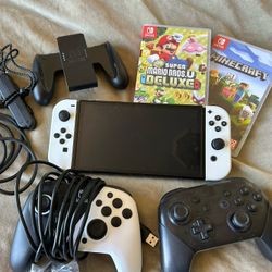 OLED Nintendo Switch with controller and games