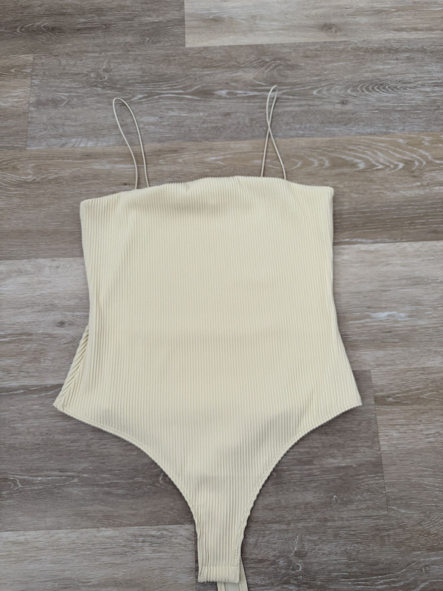 H&M ripped creme bodysuit
