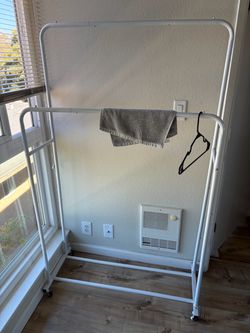 Double rods garment rack with wheels