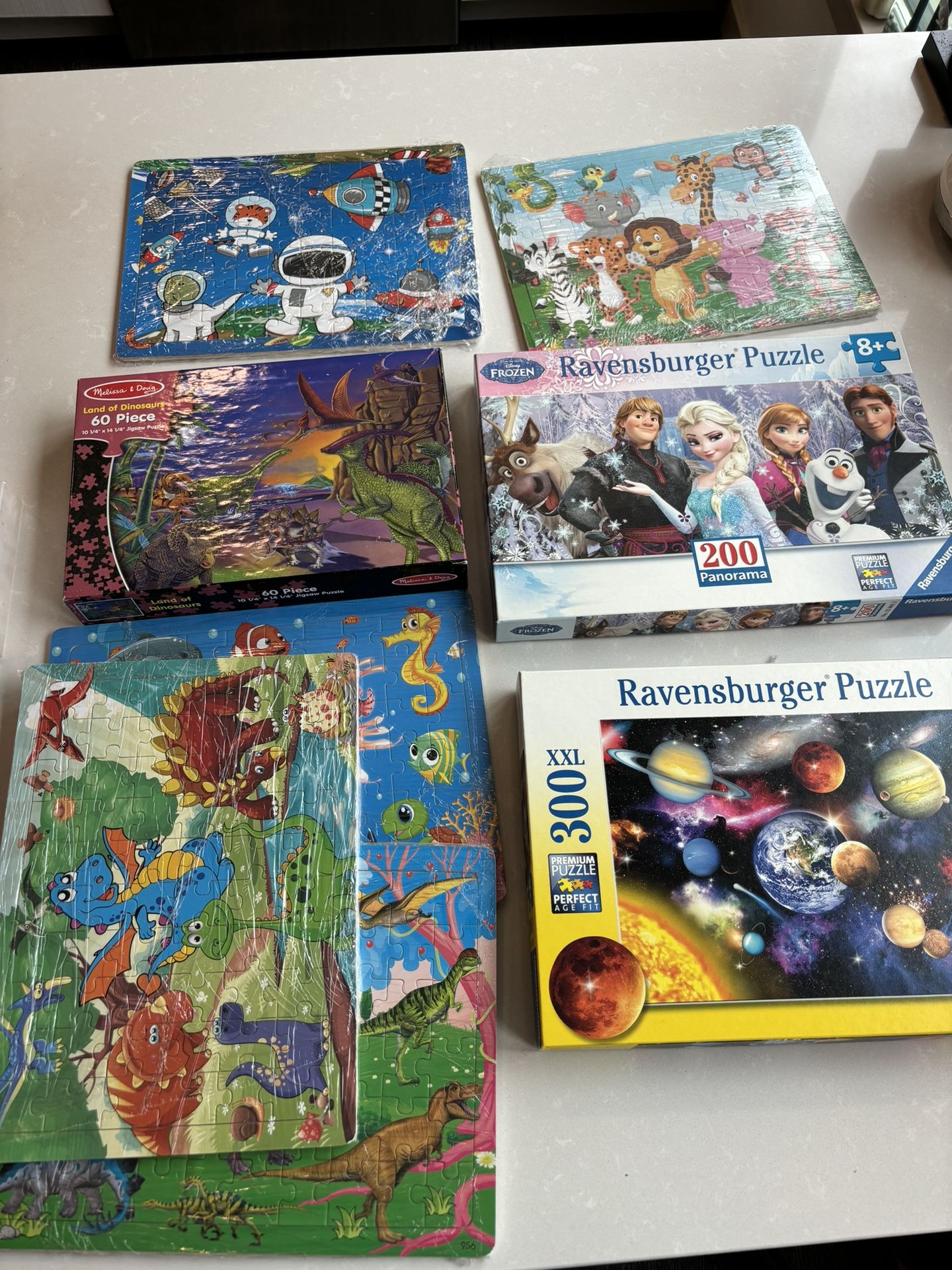 8 Boxes Of Puzzles Total for $10,like New