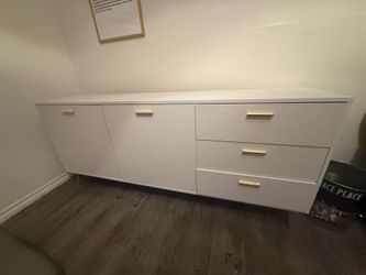 White dresser with gold handles