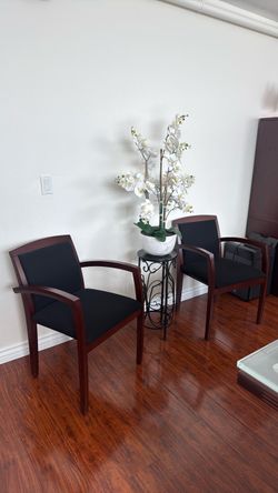2 Brown wooden chairs