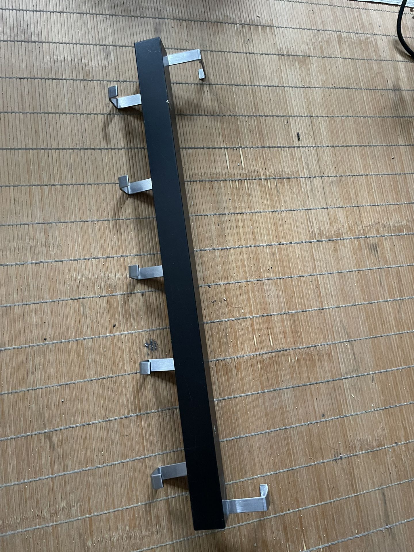 Wall/door rack with knobs, black, 23 ½ "