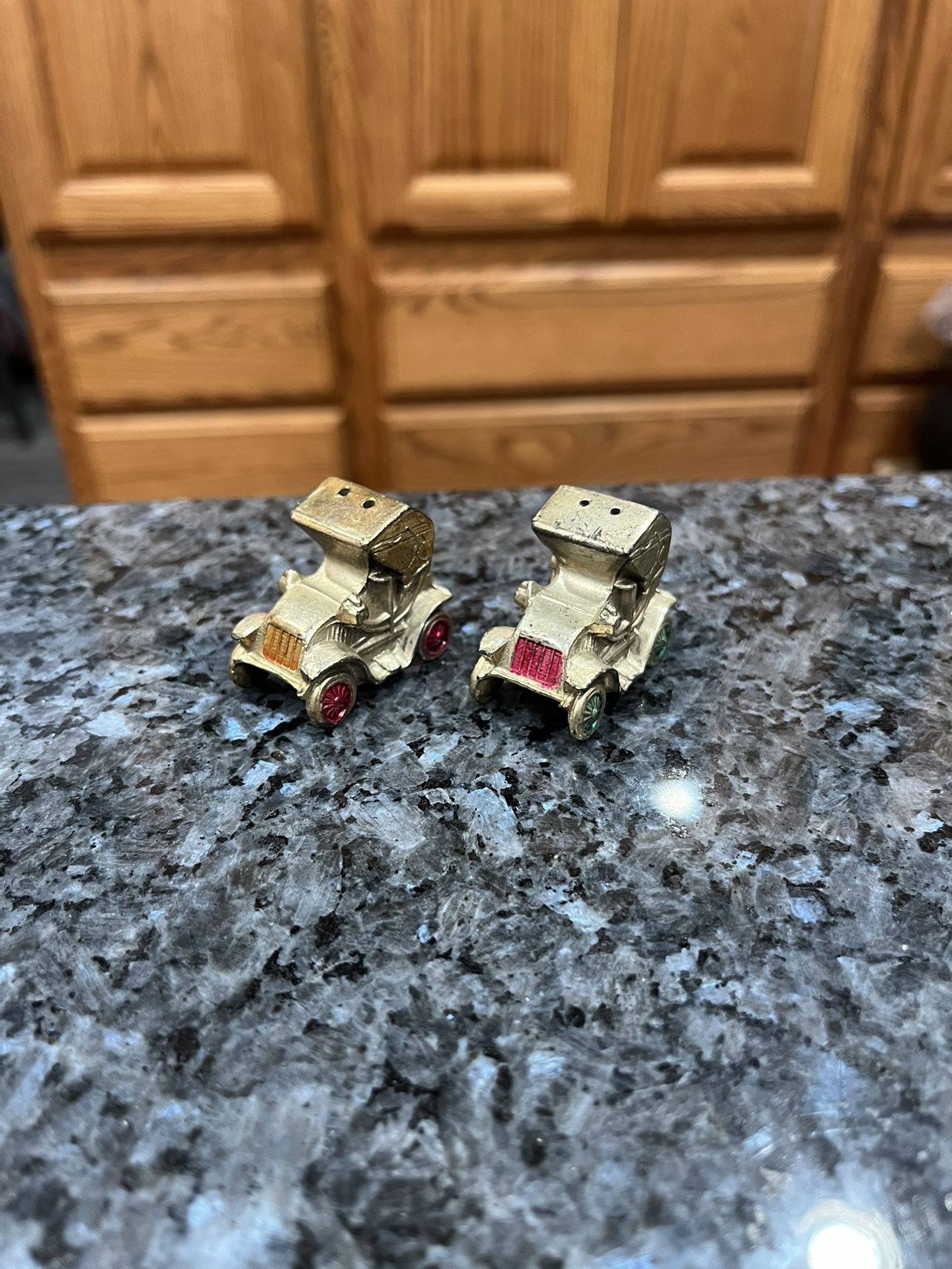 Vintage 1960s Model Roadster Pair of Salt And Pepper Shakers. Size approximately 1 1/2 inches long. Preowned with original cork stoppers.