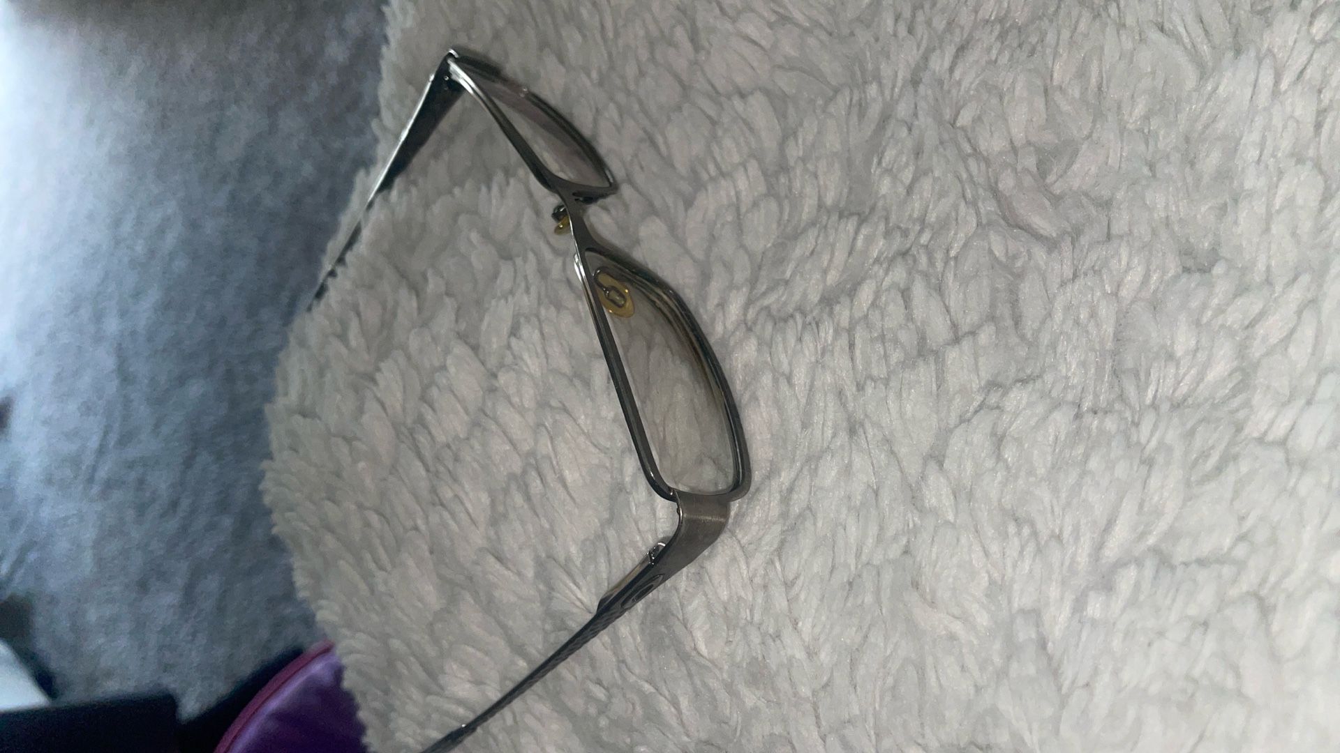 Oakley Poetic 4.0 eyeglass frame in a polished chocolate brown oval style