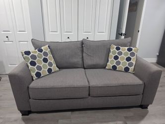 Gray Loveseat with pull-out mattress